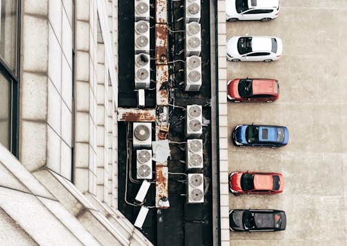 aerial photo of air condenser units and cars