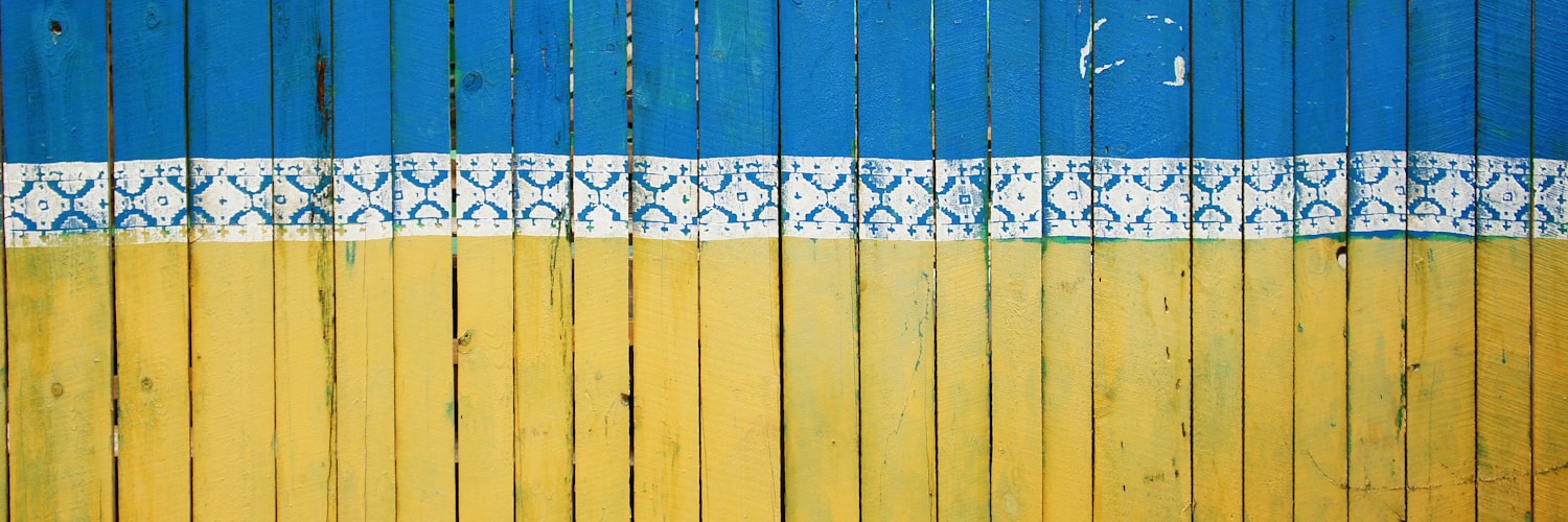 yellow and blue wooden fence