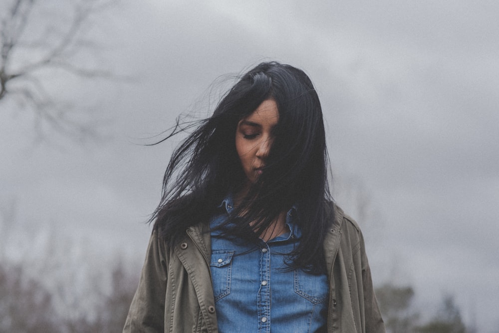 woman in denim button-up shirt