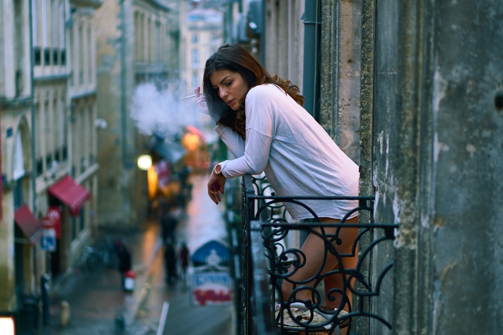 woman wearing white long-sleeved shirt