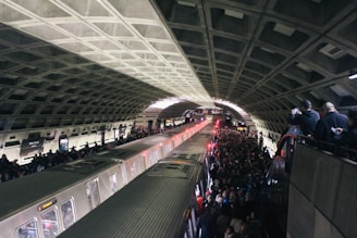 A bustling metro station in India filled with commuters during rush hour.