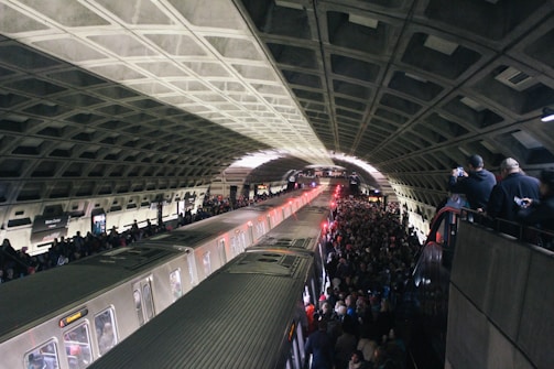 A busy metro station filled with commuters during rush hour.
