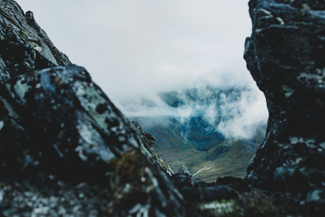 rock formation under sea of clouds