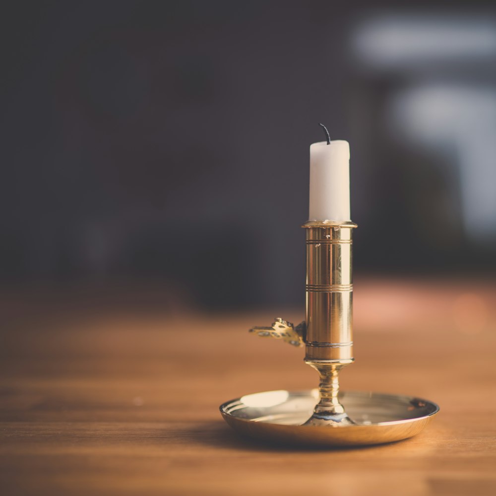 silver candlestick with white candle