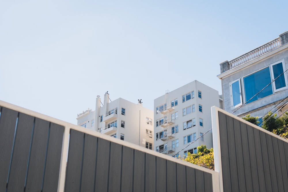 high-rise white concrete building under blue sky during daytime