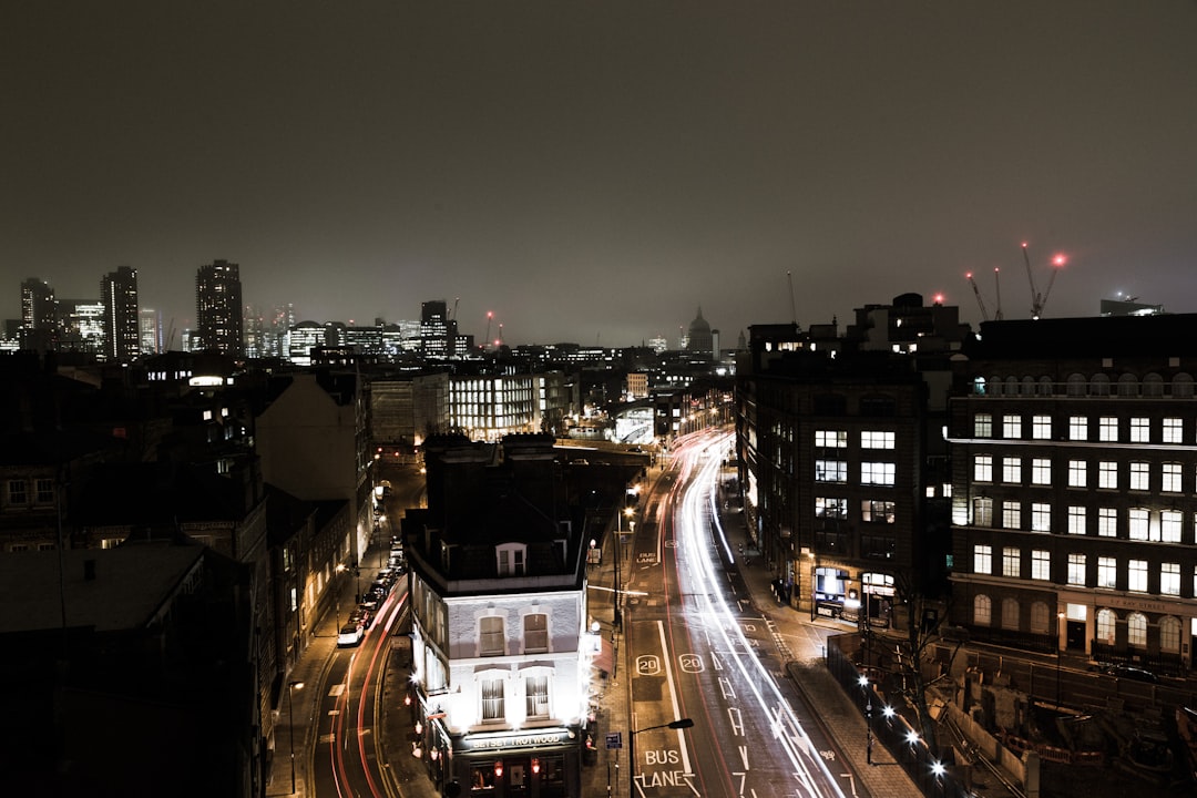 aerial photography of vehicles passing on road at night