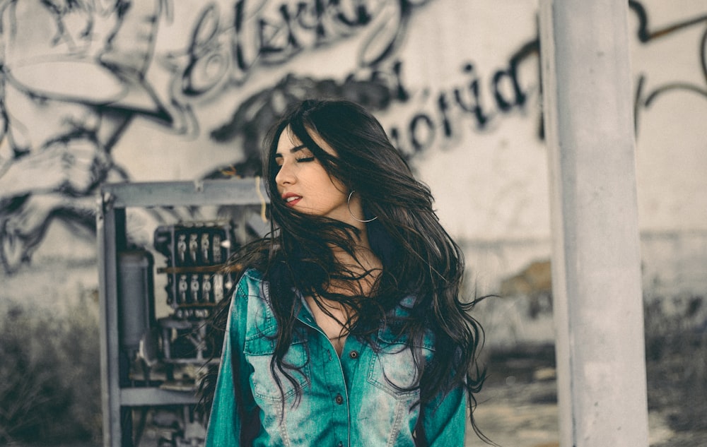 woman in teal and white top outdoor