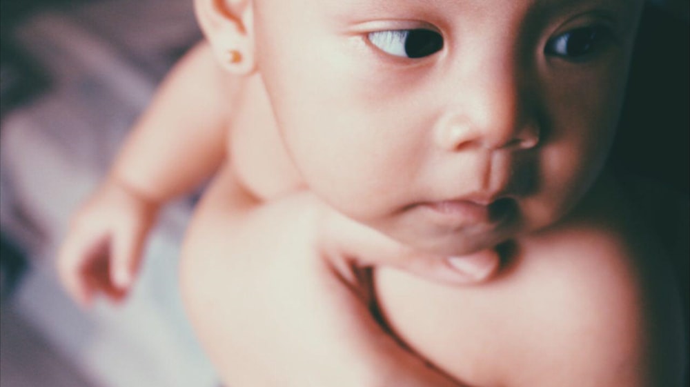close-up photography of naked baby