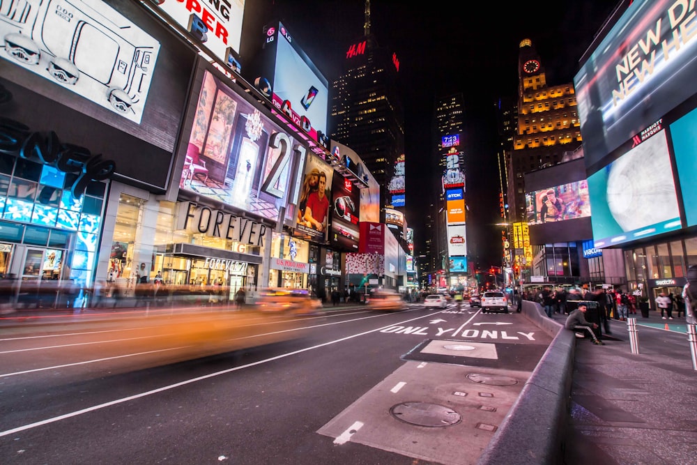 Time lapse shot of cars driving through Times Square, New York at night-time