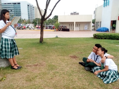 A cheerful international student meeting a local mentor in a European city park.