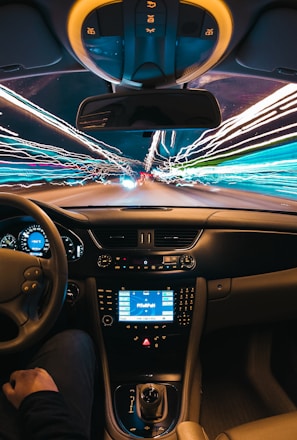 time lapse photography of man riding car