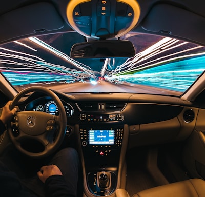 time lapse photography of man riding car