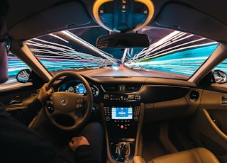 time lapse photography of man riding car