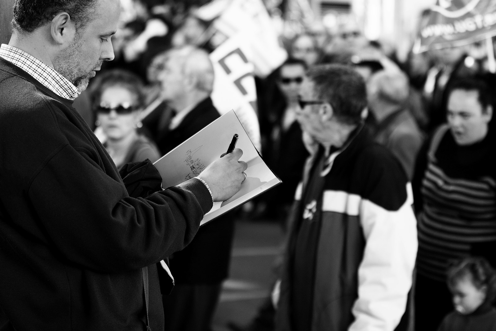 Canon EOS 50D + Canon EF 70-200mm F2.8L IS II USM sample photo. Grayscale photo of man photography