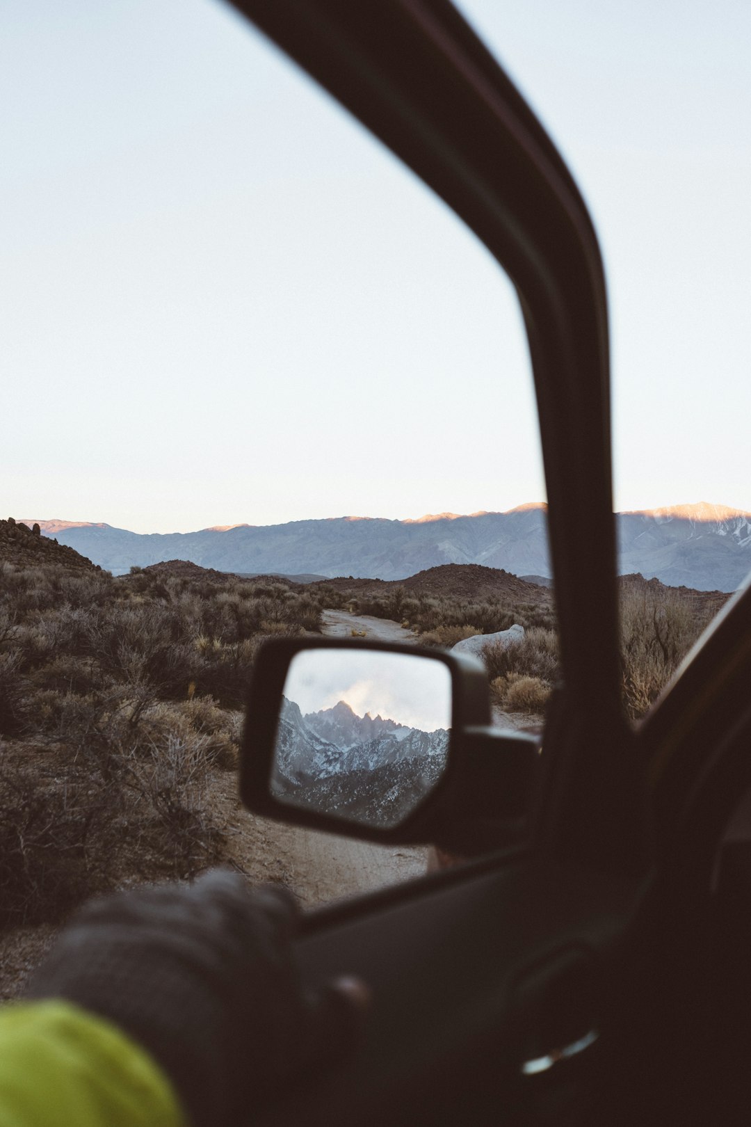 Driving through dirt roads in the Sierras, had to stop and take this photo at sunset. The mountain in the mirror is Mt Whitney, highest summit in the contiguous states.