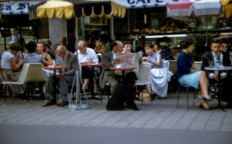 An outdoor café filled with local customers enjoying their time.