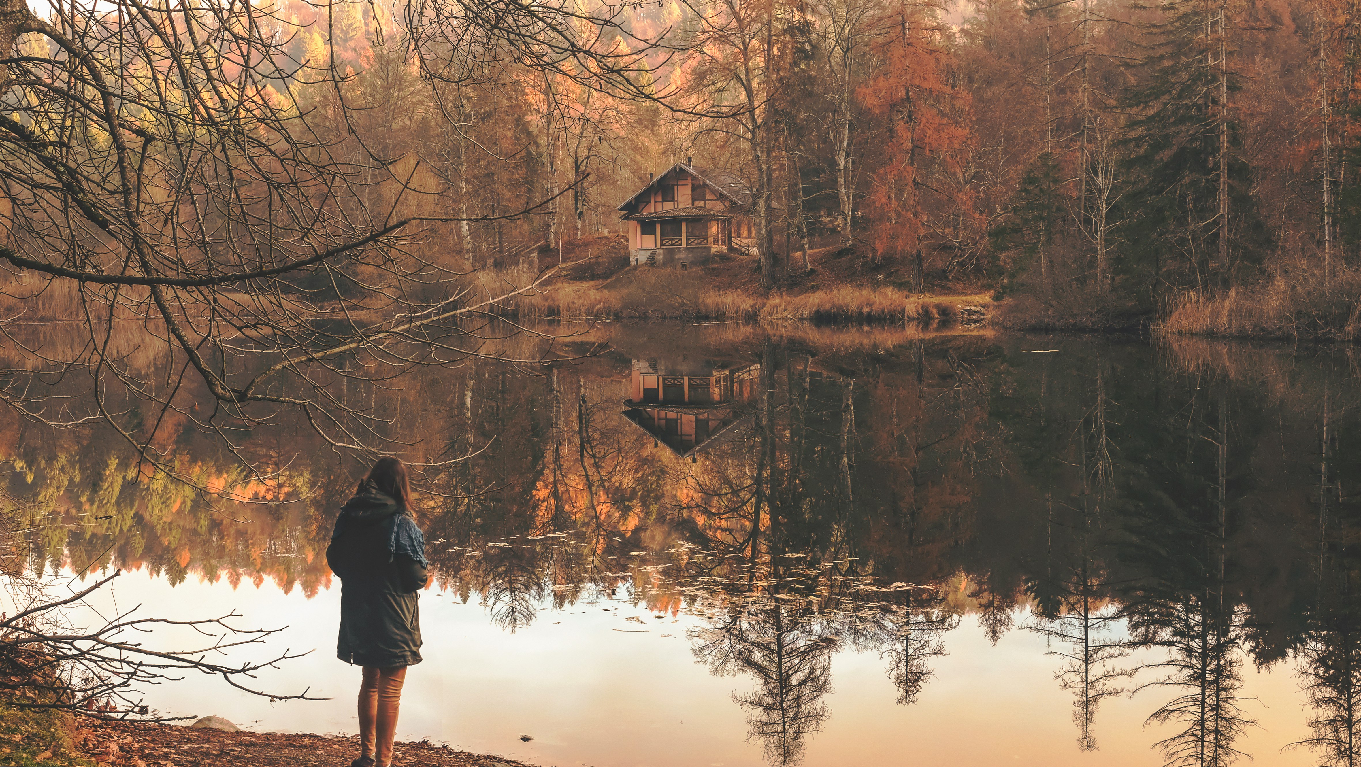 Woman over an autumn lake