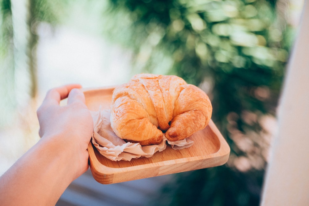 croissant on wooden plate