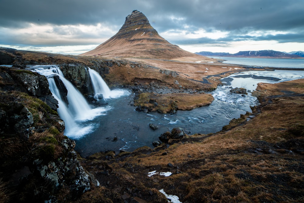 rock formation surrounded with water