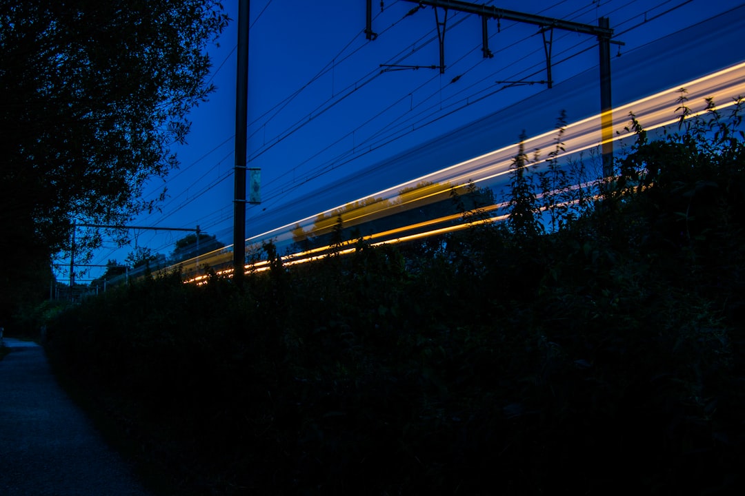 time lapse photography of train rail