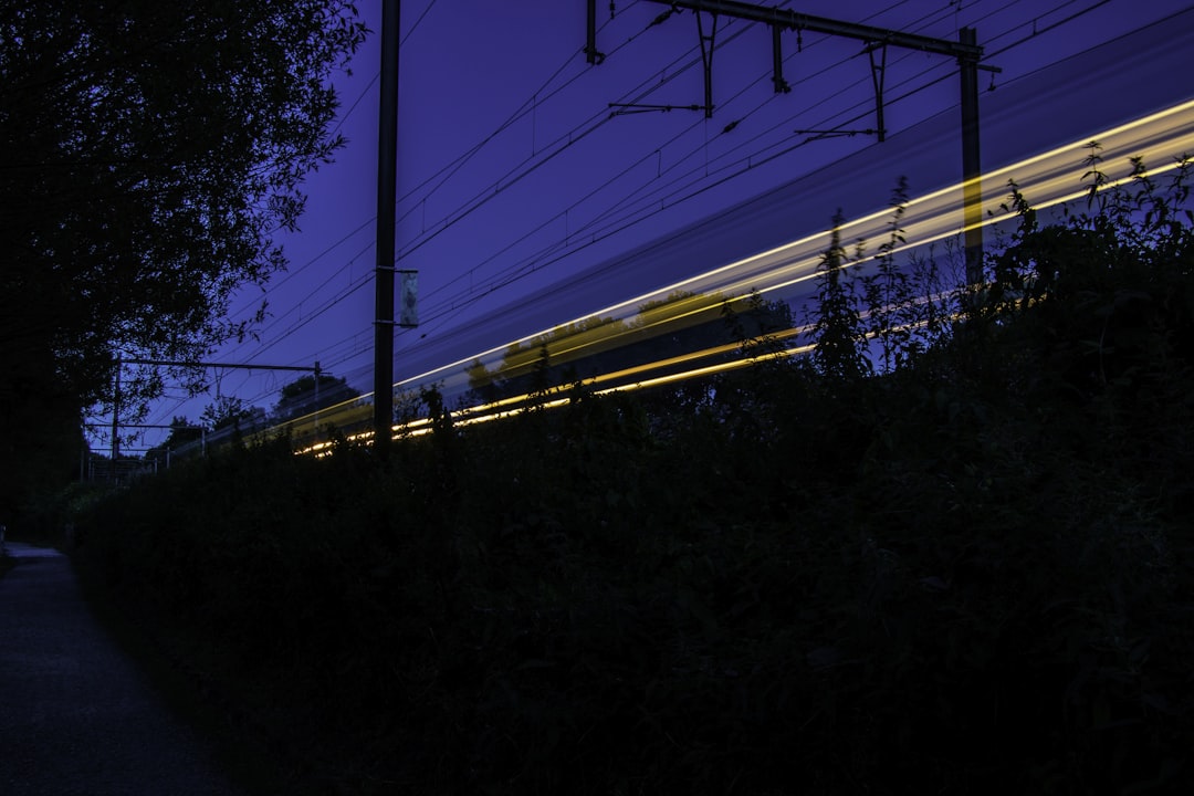 time lapse photography of train rail, Train track light trail in Jette