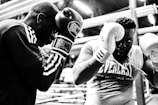two men wearing boxing gloves