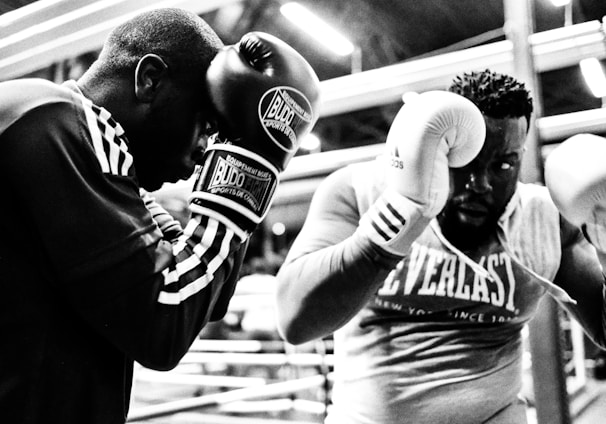 two men wearing boxing gloves