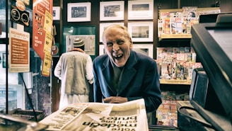 man in black suit jacket while smiling