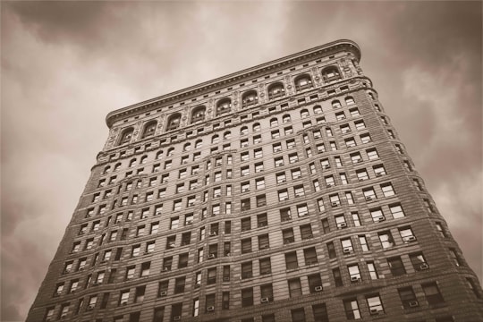 low angle sepia photography of a high-rise building in Madison Square Park United States