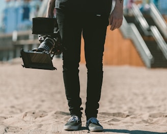 person holding shoulder-mount camcorder