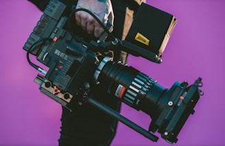person carrying black camcorder for a film production company new york