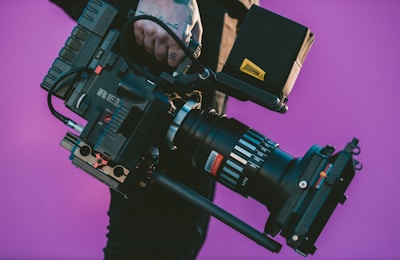 person carrying black camcorder for a film production company new york