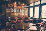 A cozy pub corner with cushioned benches and soft glowing wall lights