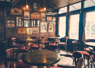 round wooden cafeteria tables and chairs inside room