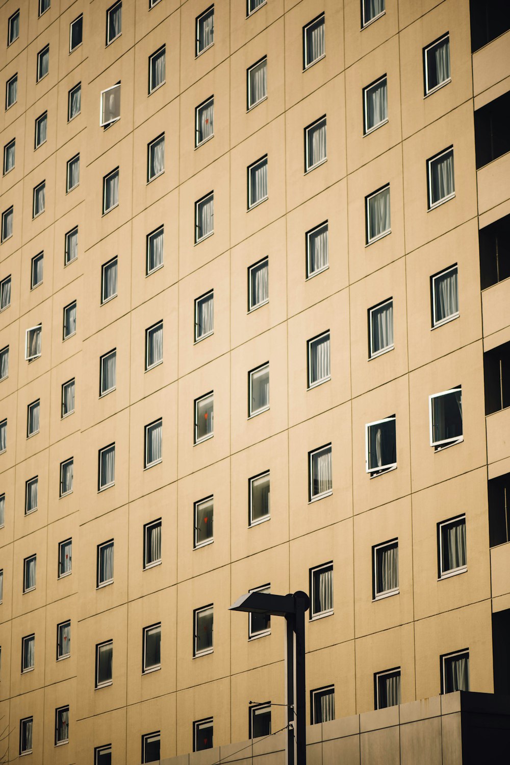 beige concrete high rise building facade