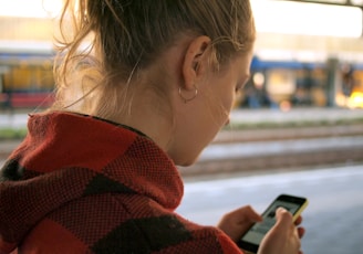 woman holding phone