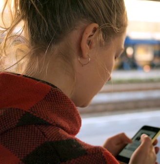 woman holding phone