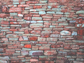 Outdoor decorative stone wall featuring a mix of natural and artificial stone textures.