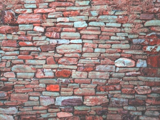 Outdoor decorative stone wall featuring a mix of natural and artificial stone textures.
