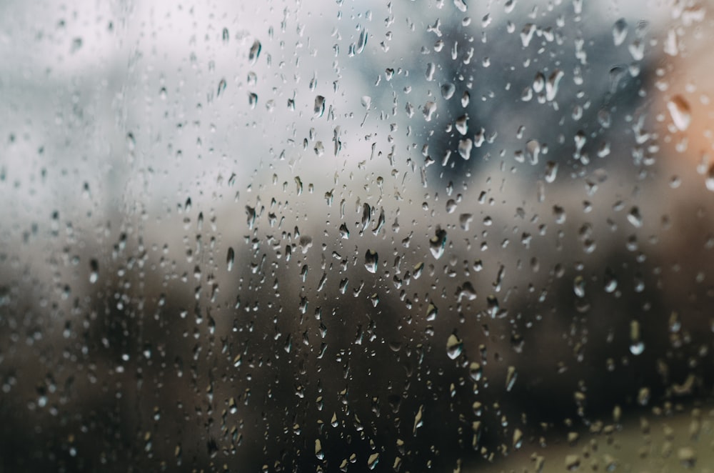 rain drops on a window with a blurry background