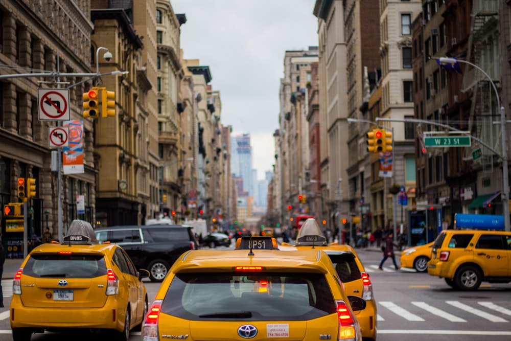 yellow cab in between of building