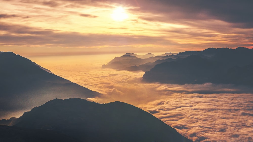 photo of mountain at sunset