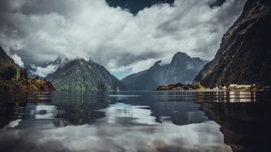 mountain near body of water in Milford Sound New Zealand