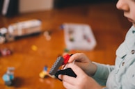A joyful child playing with a creative building set.