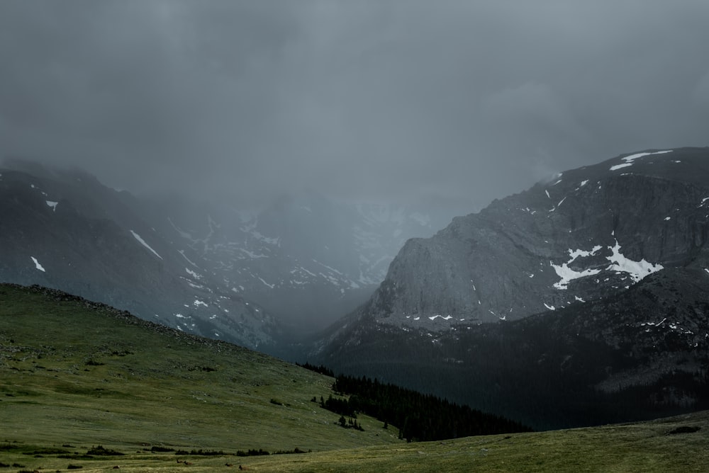 green mountain under cloudy sky