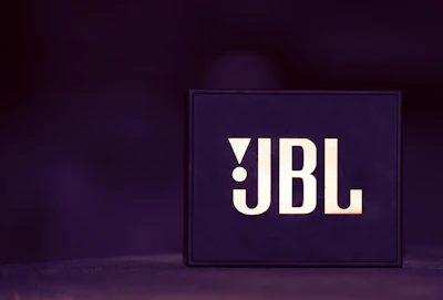 Logo of JLG displayed on a sleek industrial background.