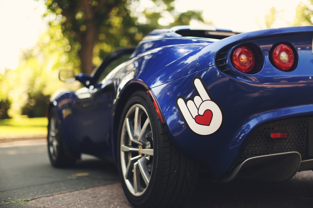 blue car parked on road