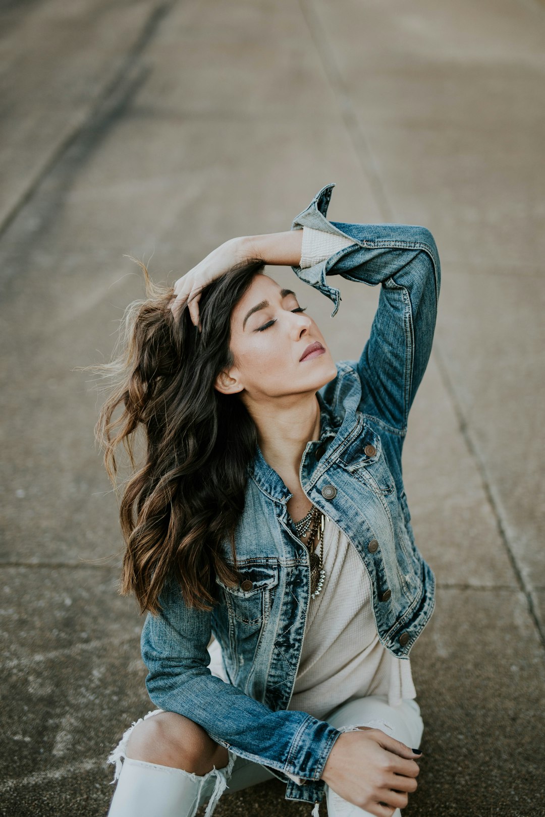 woman wearing blue denim jacket