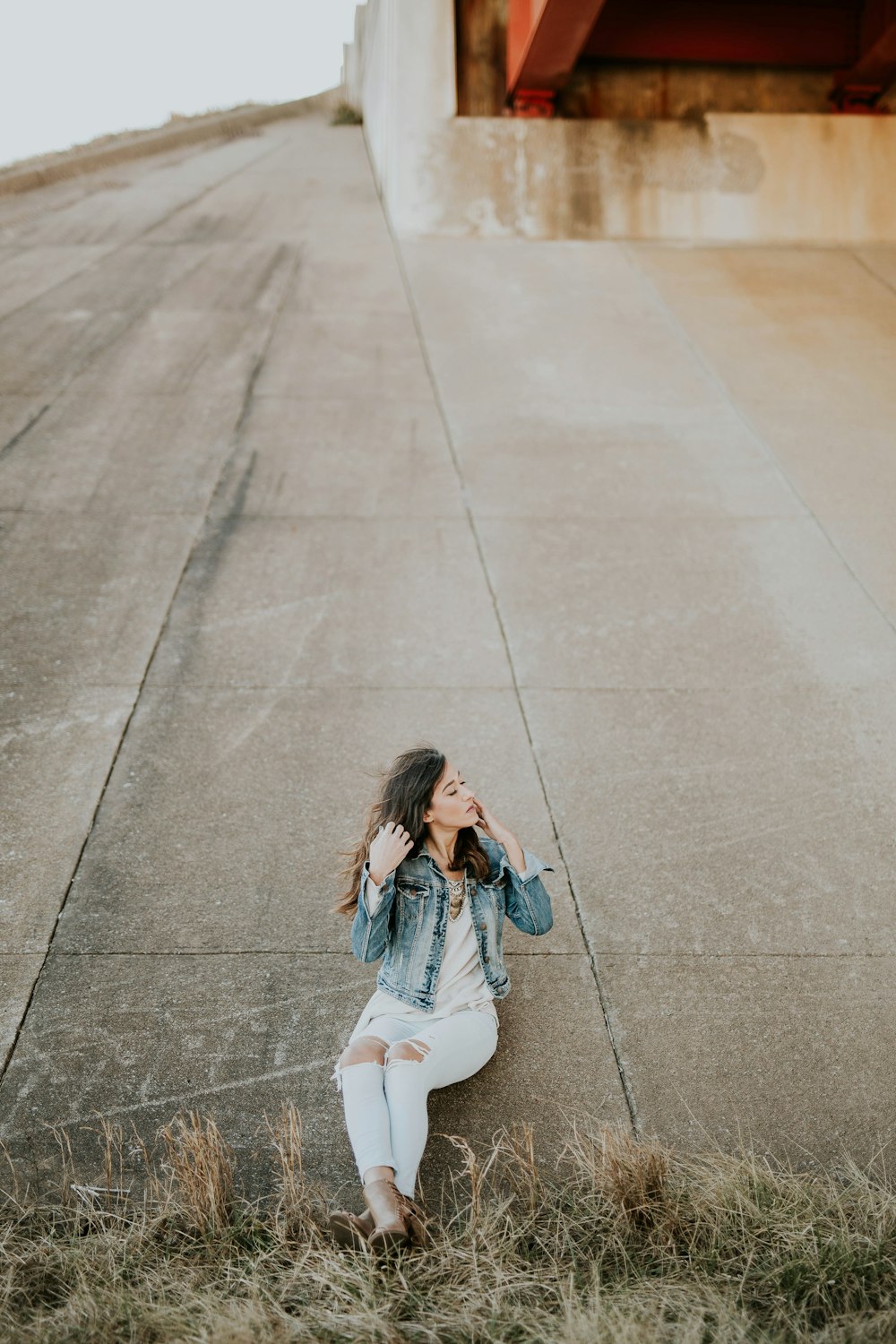 woman leaning on wall