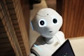 white robot near brown wall